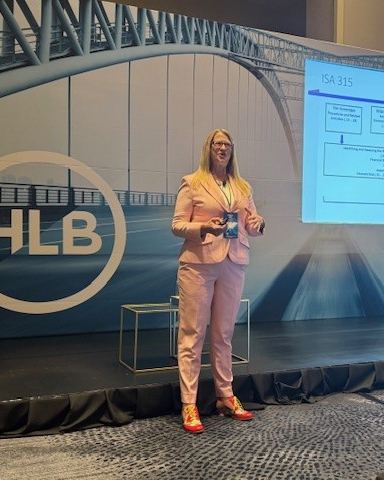 Kirsten S. Albo presenting at an HLB international conference
